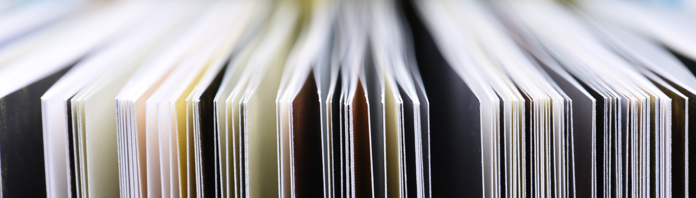 A close-up of pages of a book with lots of bokeh.