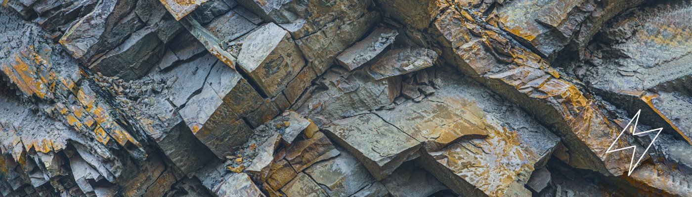 close up image of a grey and brown rock formation